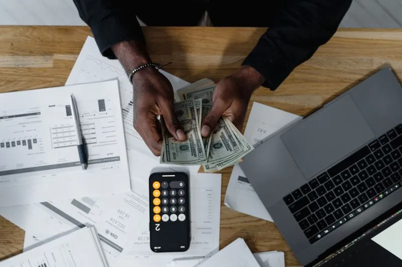 Income and earnings shown beside a laptop