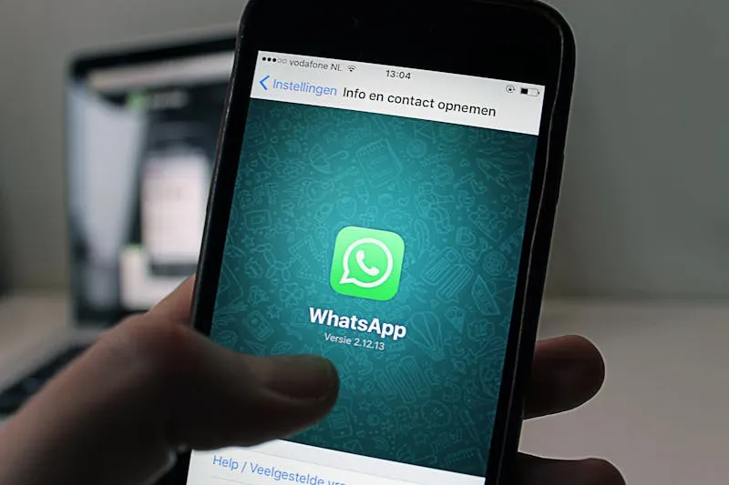 Person sending a message on a smartphone