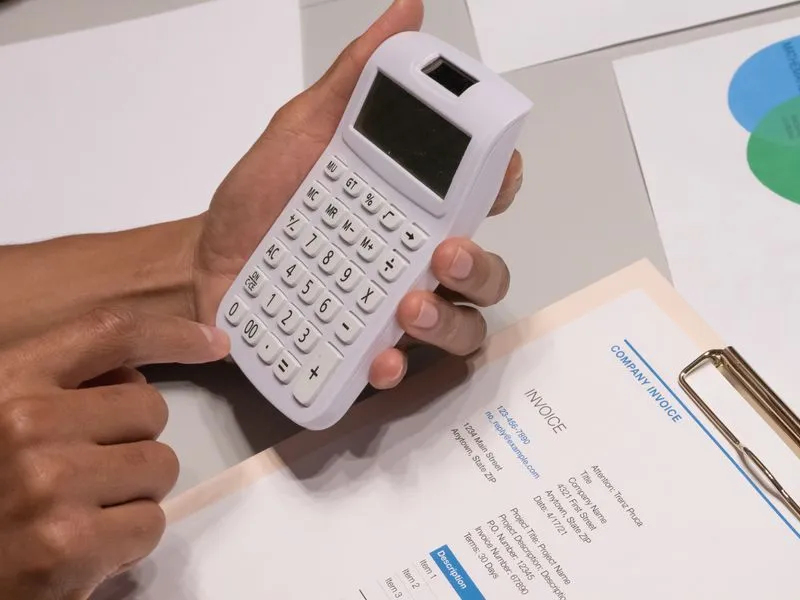 Calculator and budget planning documents on a desk