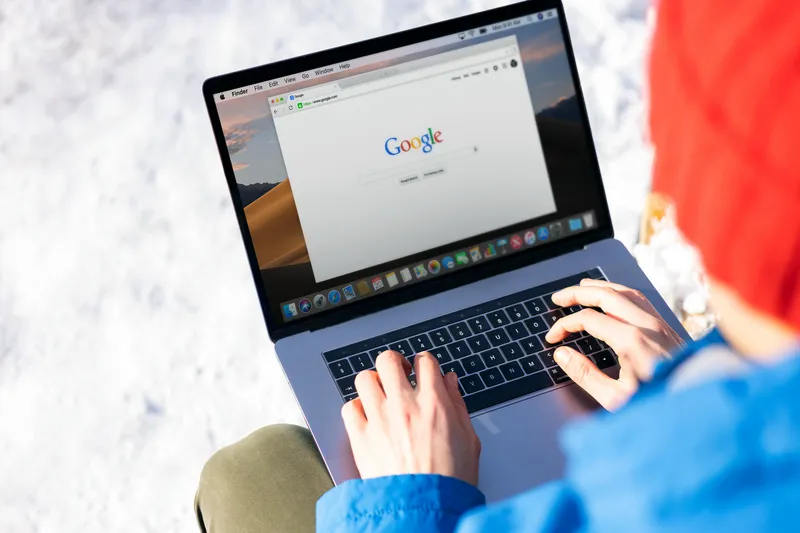 Person analyzing search terms on a laptop