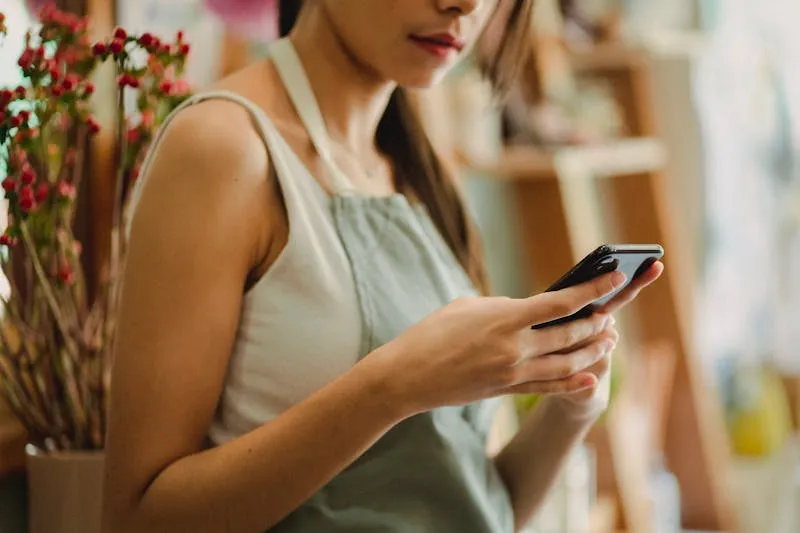 Small business owner on a smartphone