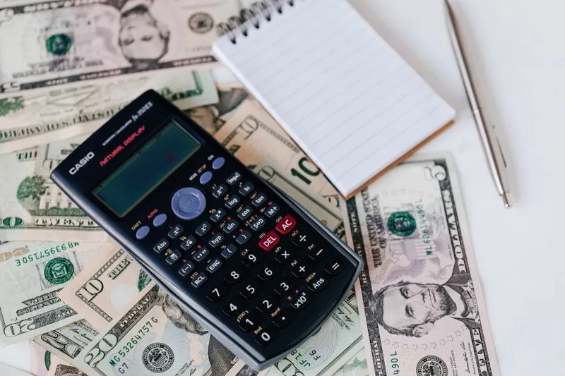 Calculator and budget figures on a desk